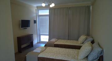 Фото номера Апартаменты с душем Гостиница Guest house Olimpiya г. Заозёрное 5